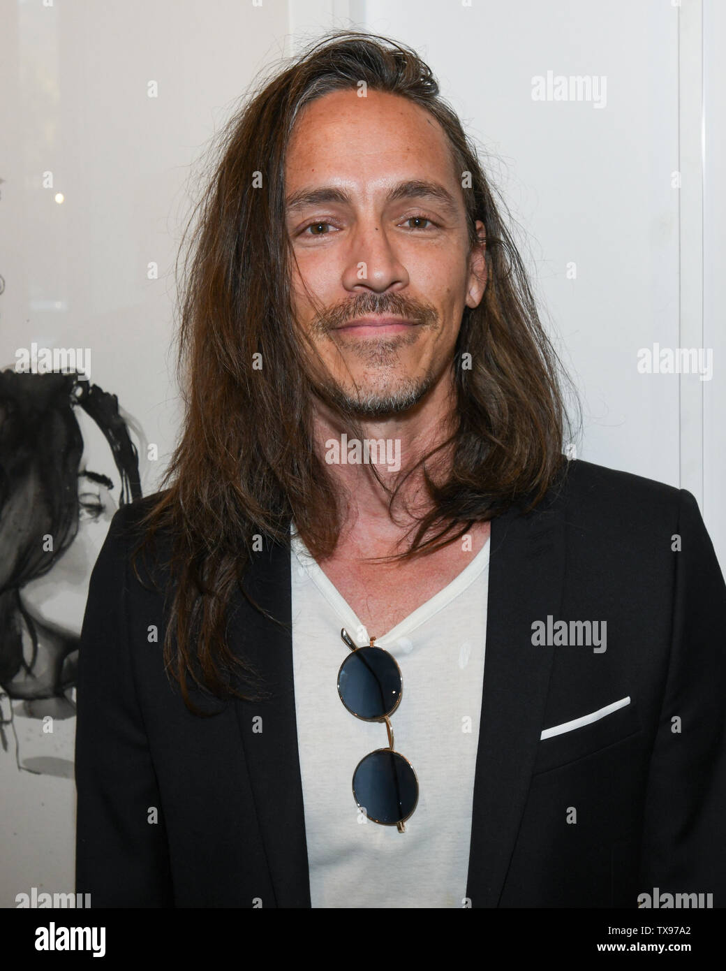 June 23, 2019 - Brandon Boyd with his art work at the 'Love and Art' group show at the Lumber Yard Gallery in Malibu, California. (Credit Image: © Billy Bennight/ZUMA Wire) Stock Photo