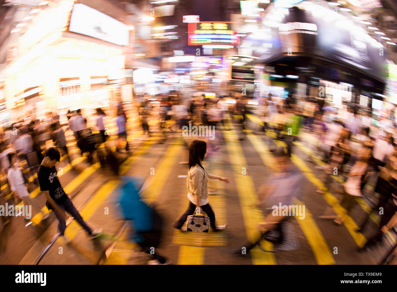 Elevated view of a pedestrian crossing a road in Hong Kong. China. Stock Photo
