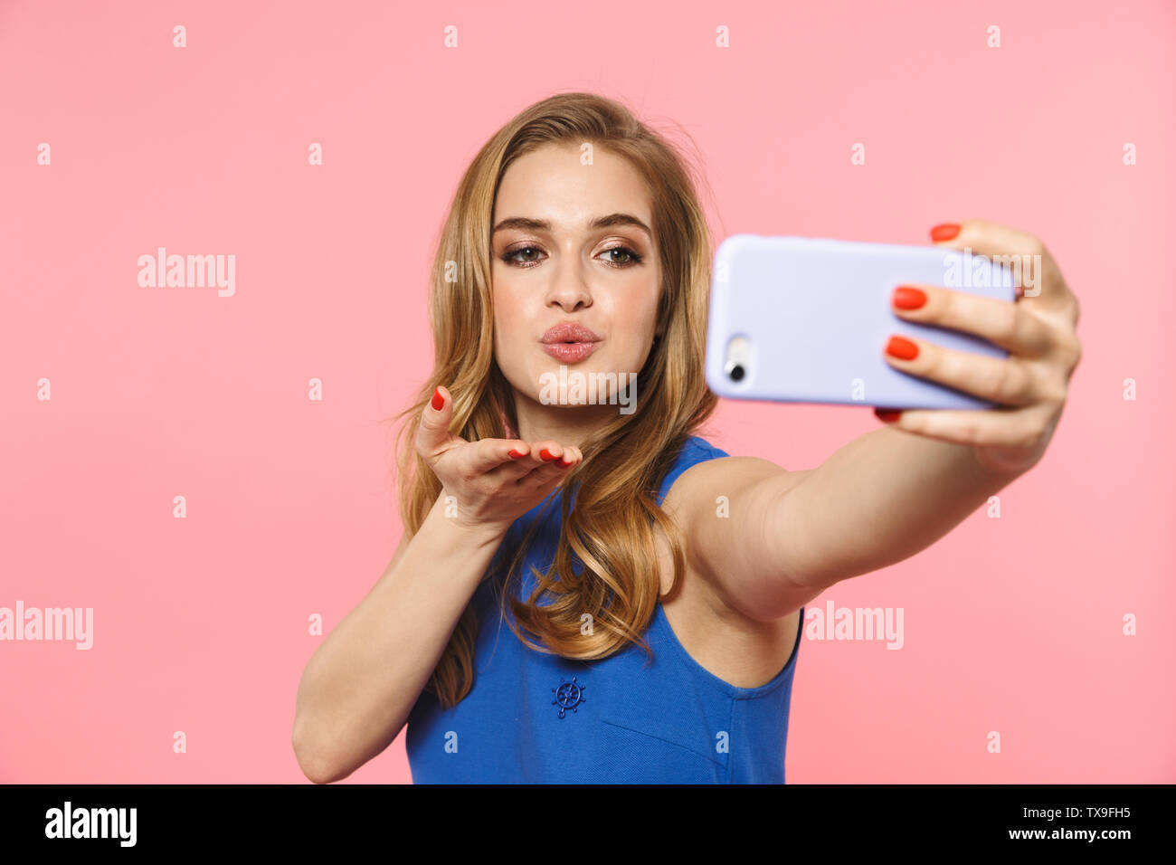 Image of a beautiful excited young pretty woman posing isolated over ...