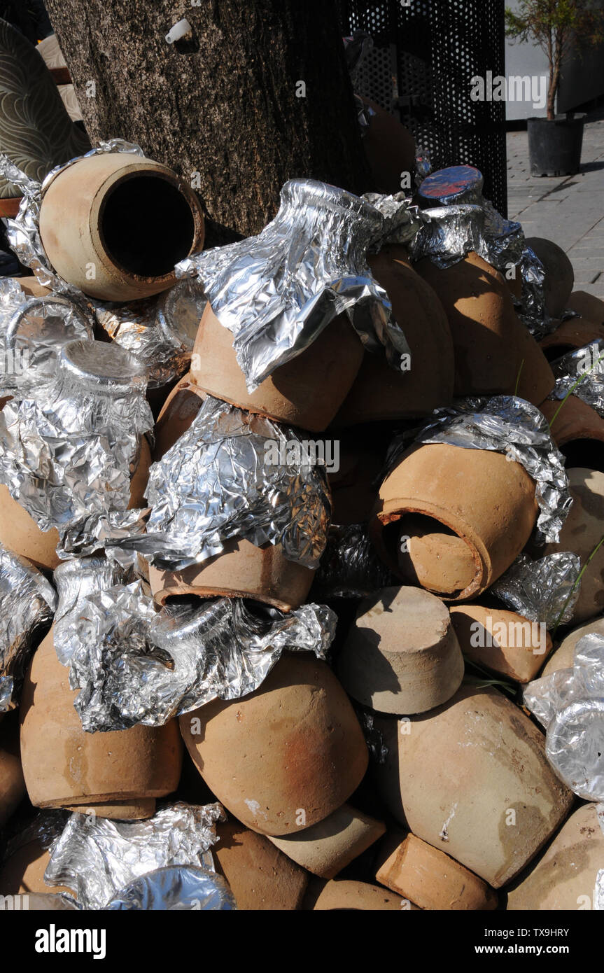 Clay cooking pots outside restaurant, Istanbul Stock Photo