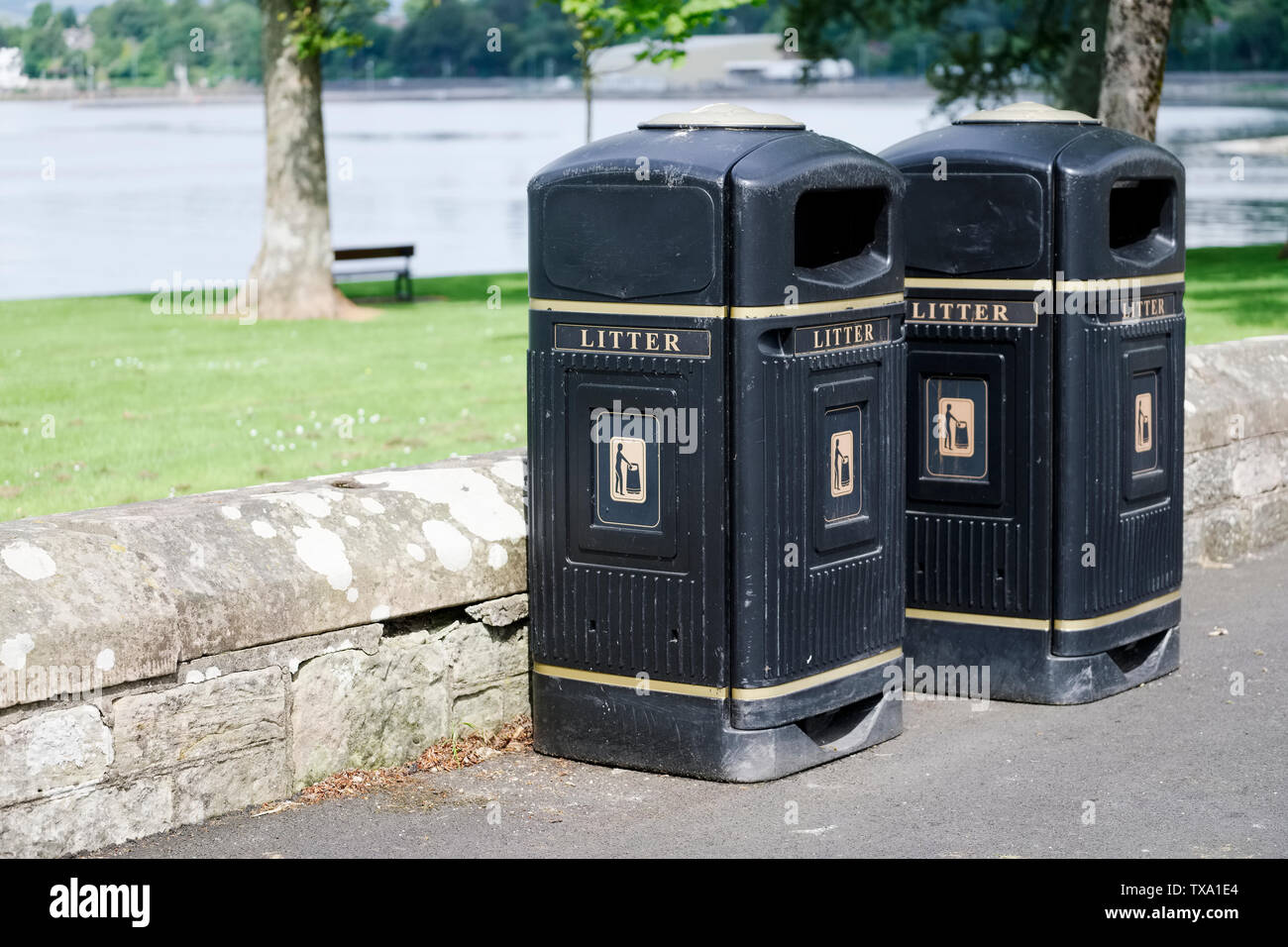 Black British bins at park at seaside Stock Photo Alamy