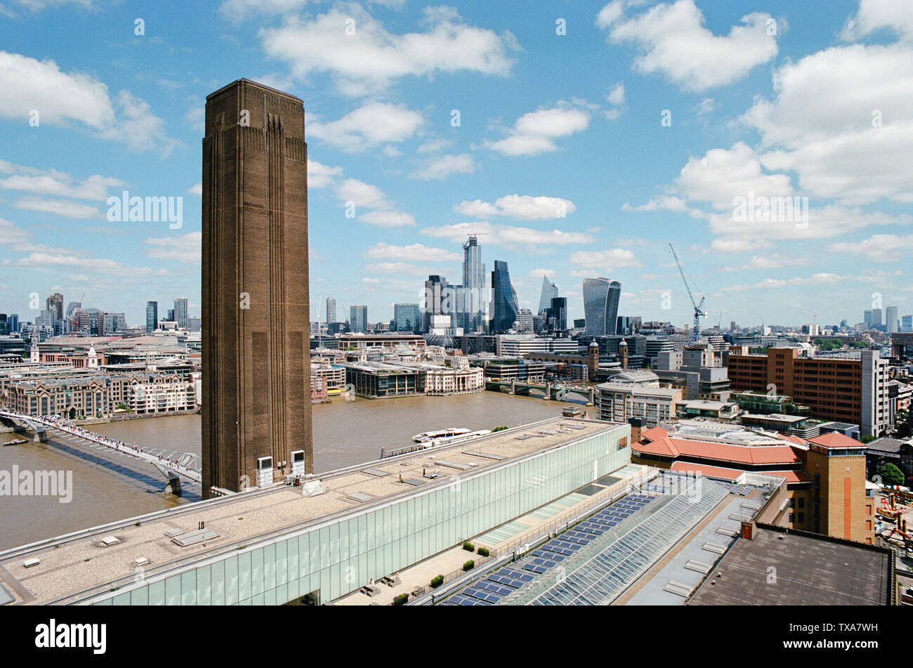 View of the City of London from the top of the Tate Modern, with a bird's eye view of the Millennium Bridge, London Bridge and the Square Mile Stock Photo