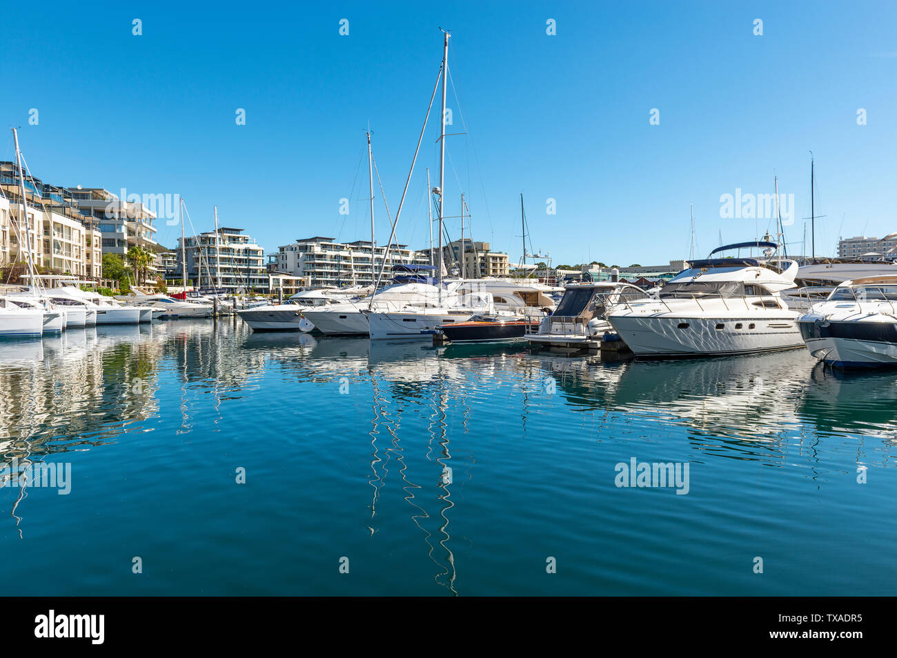 Reflection of the yacht marina in Cape Town on a summer day, Western Cape province, South Africa. Stock Photo
