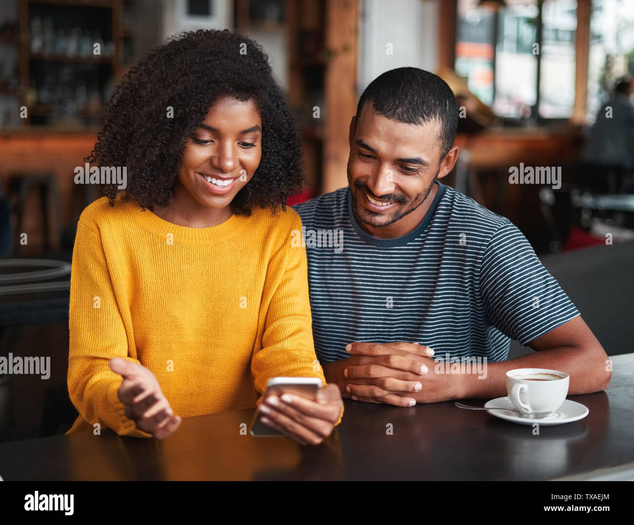 Young couple looking at mobile phone Stock Photo