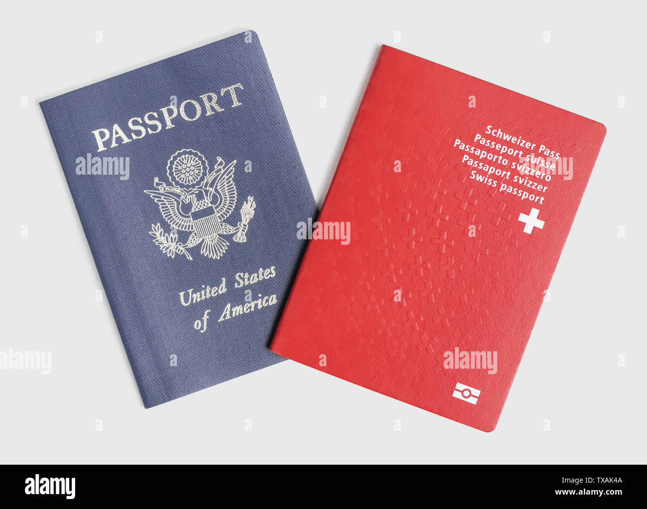 London / UK - 21st June 2019 - US and Swiss passports on a white background Stock Photo