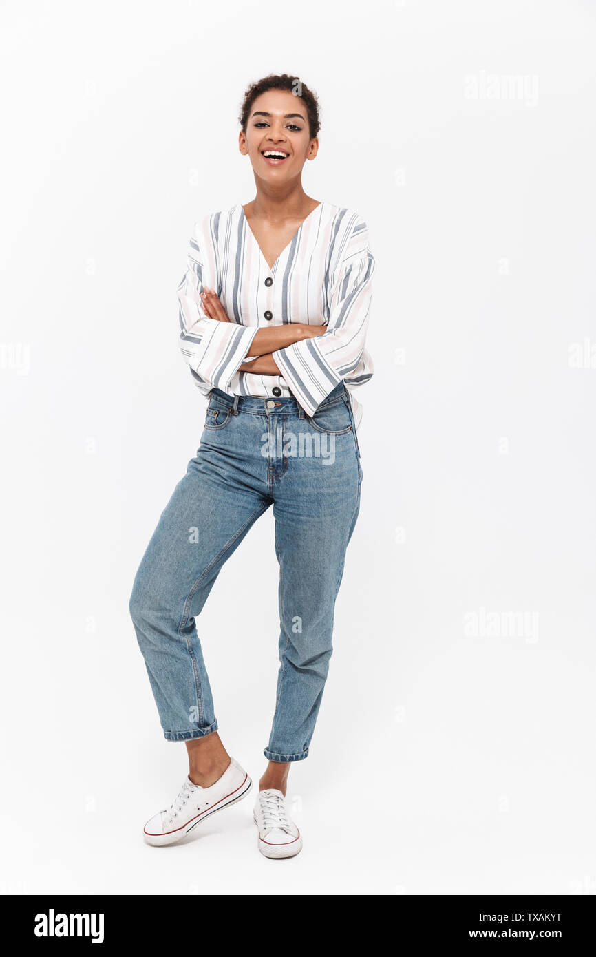 Full length portrait of an attractive young african woman standing ...