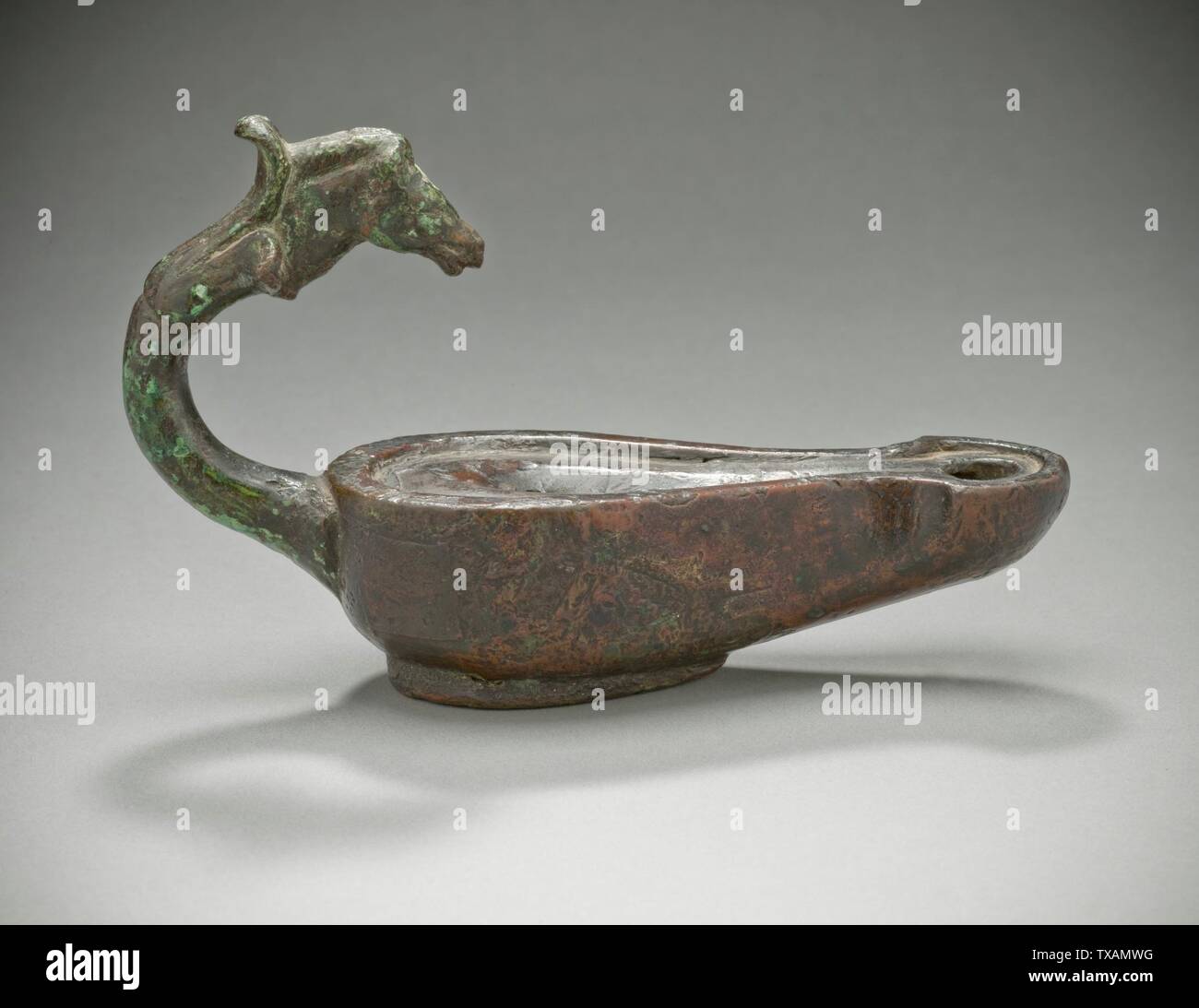Oil Lamp with Horse's Head;  Roman, 1st-3rd century A.D. Furnishings; Lighting Bronze 3 11/16 x 5 7/8 in. (9.37 x 14.92 cm) Gift of Michael and Linda Keston (M.81.256.6) Greek, Roman and Etruscan Art; 1st-3rd century A.D.; Stock Photo