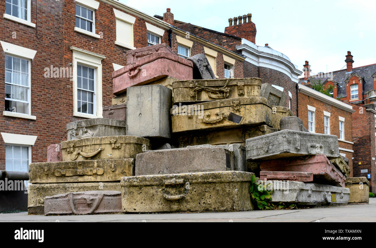 Concrete art in the form of luggage situated at junction of Hope Street