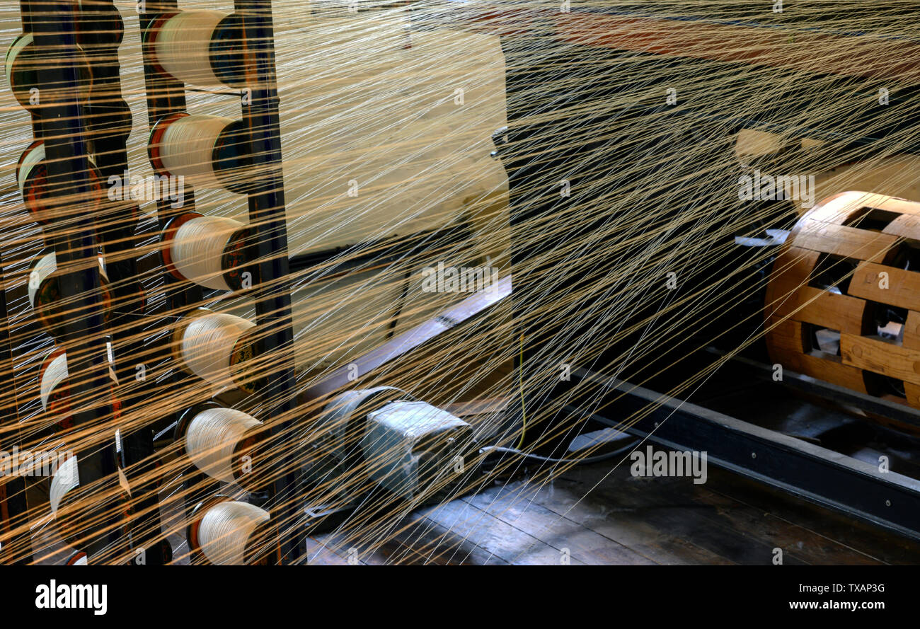 Cotton spinning at Quarry Bank Mill, Styal, Wilmslow, Cheshire, England, UK Stock Photo