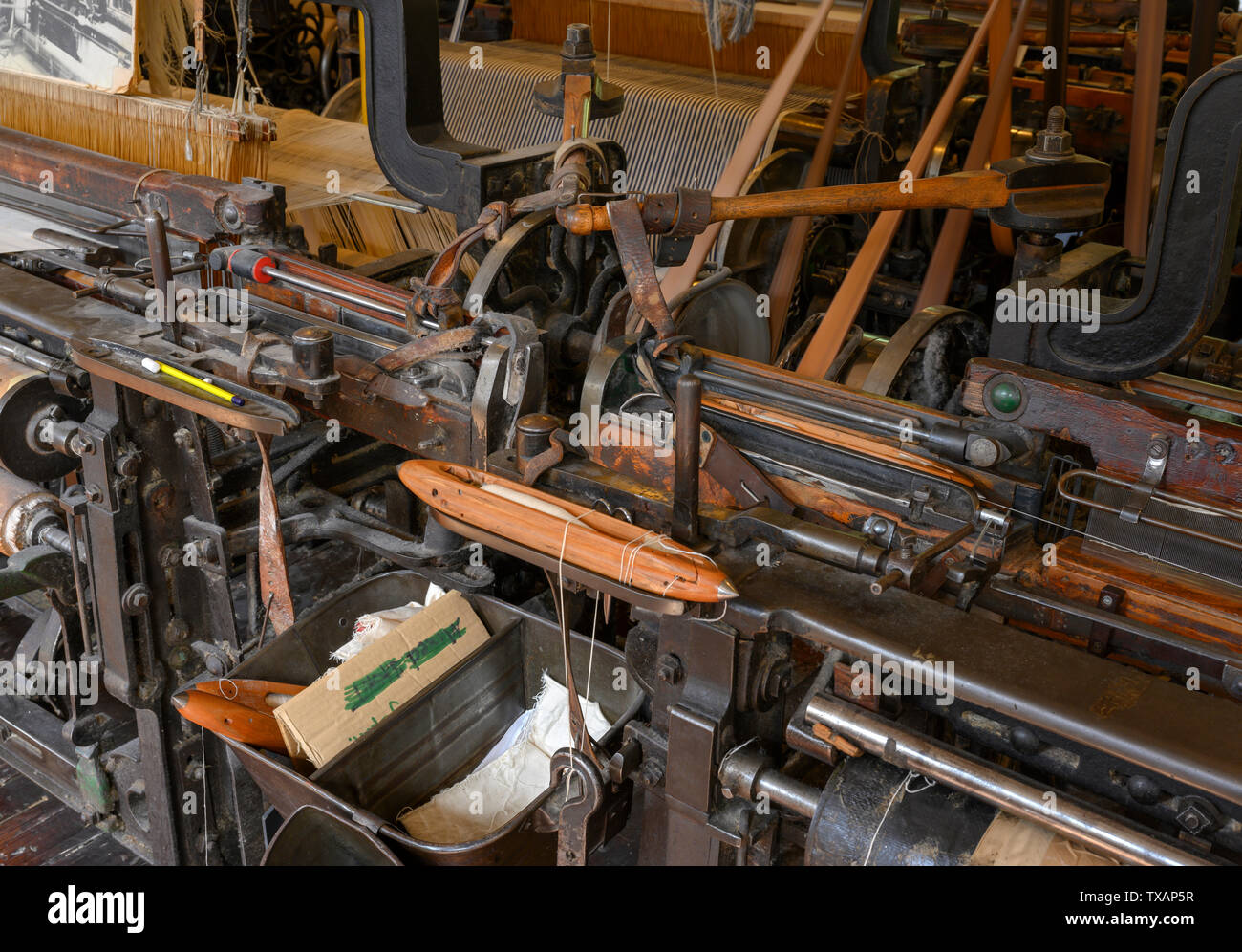 Detail view of the interior of the weaving shed at Quarry Bank Mill, Styal, Wilmslow, Cheshire, England, UK Stock Photo
