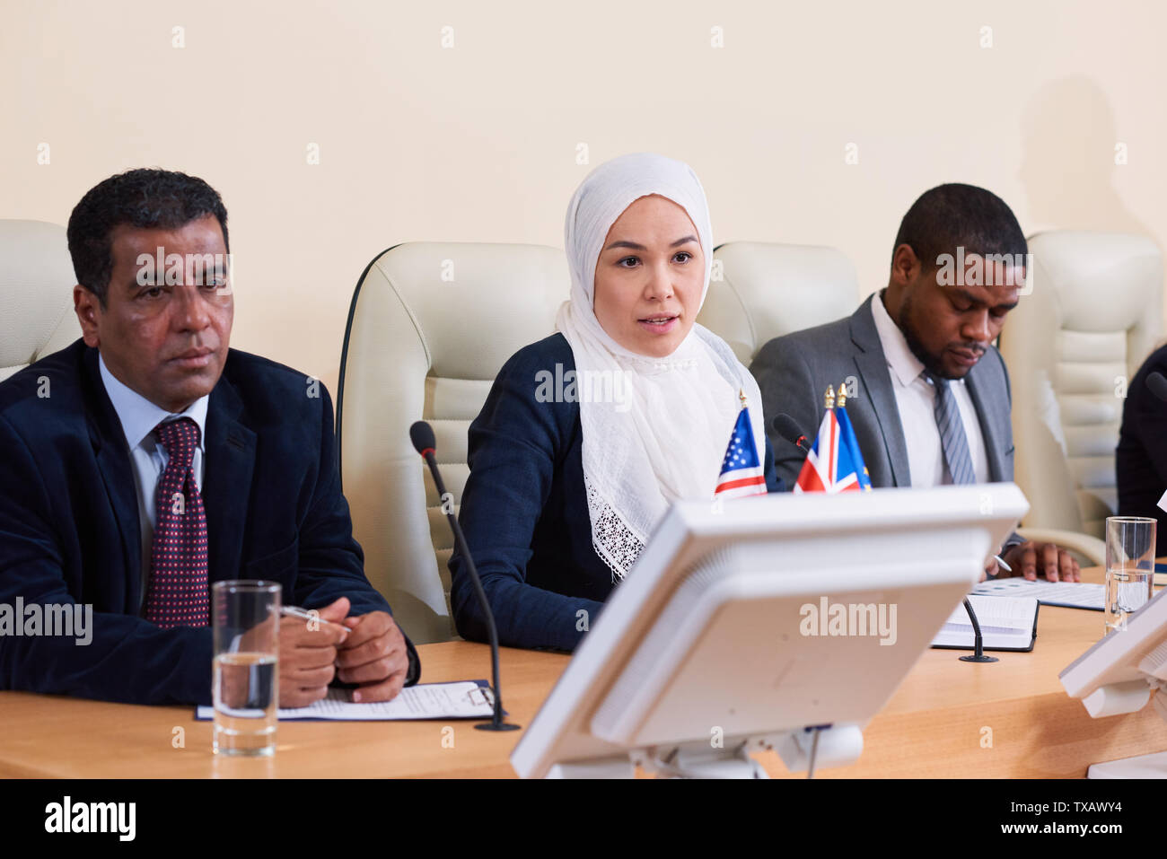 Intercultural group of young delegates or business people Stock Photo