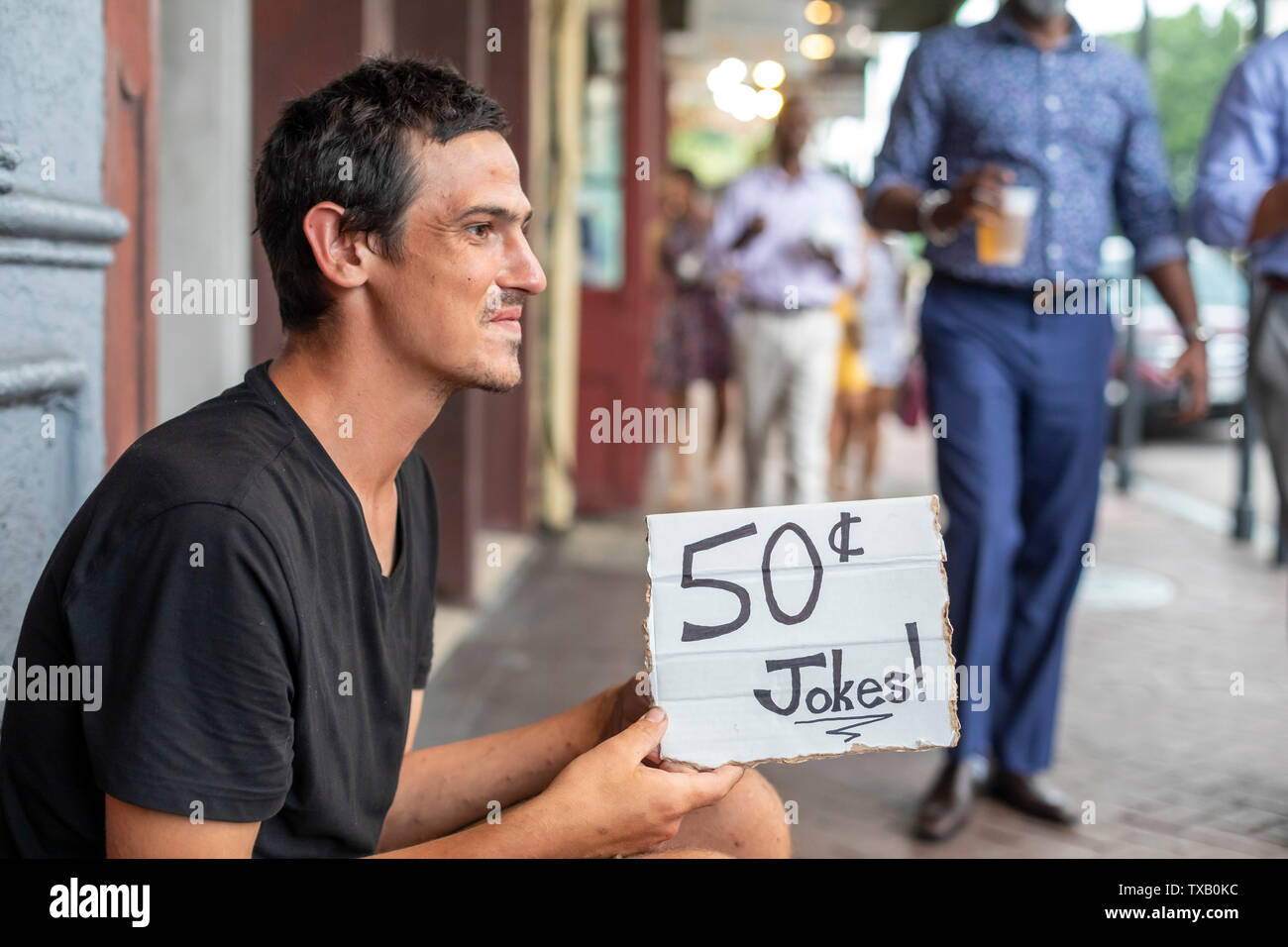 New Orleans, Louisiana - A busker in the French Quarter offers to tell a joke for 50 cents. Stock Photo