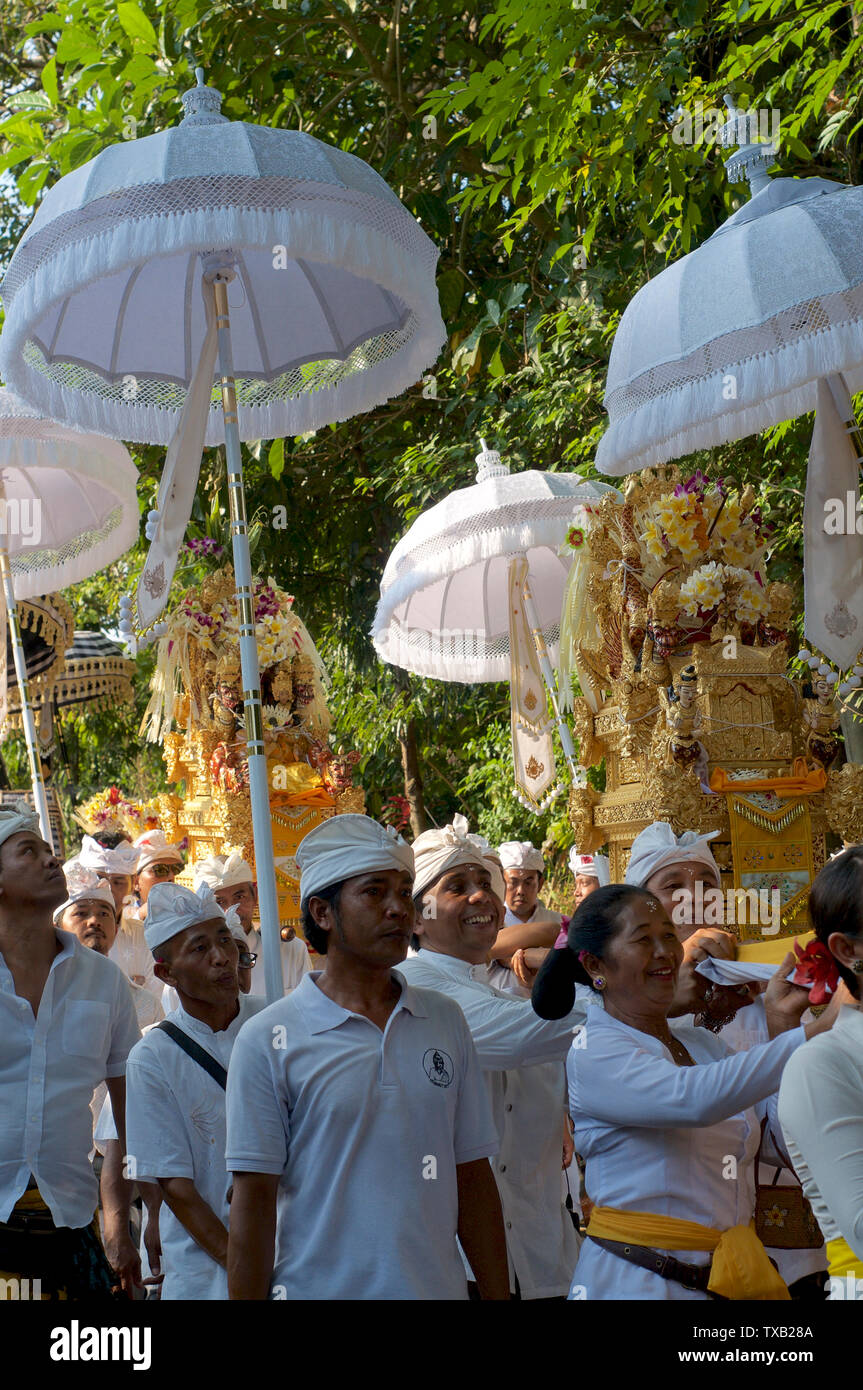 Ubud, Bali, Indonesia - 15th May 2019 : Picture of women and men walking during a traditional Balinese ceremony located in Ubud, Bali - Indonesia Stock Photo