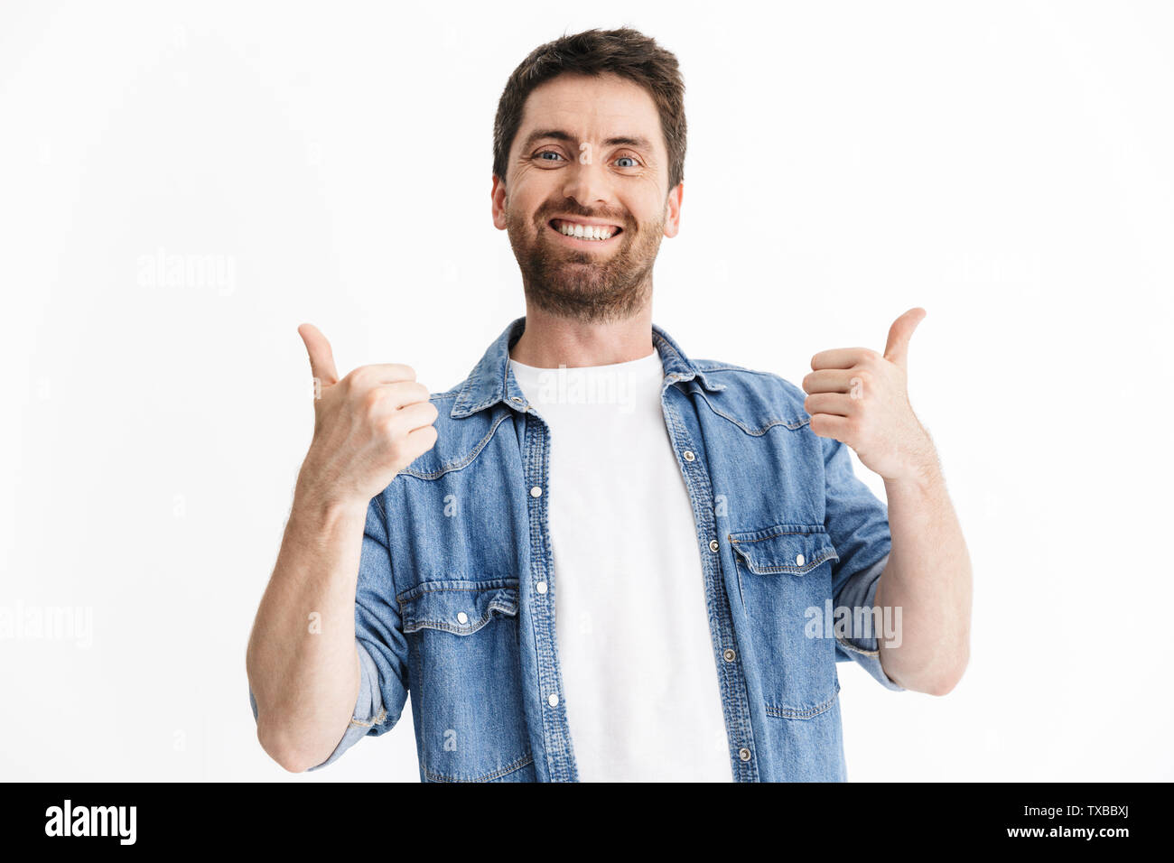 Portrait of a happy handsome bearded man wearing casual clothes ...