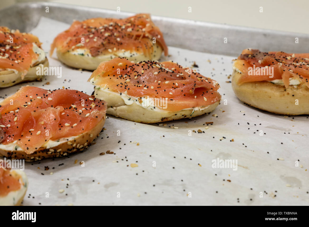 Smoked salmon lox and cream cheese on a bagel at a breakfast buffet