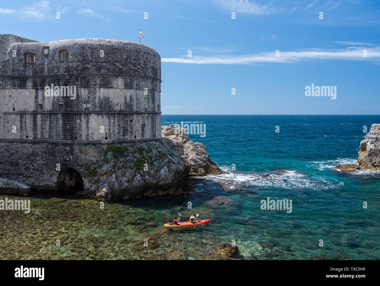 Canoe by the city walls of the old town of Dubrovnik in Croatia Stock Photo