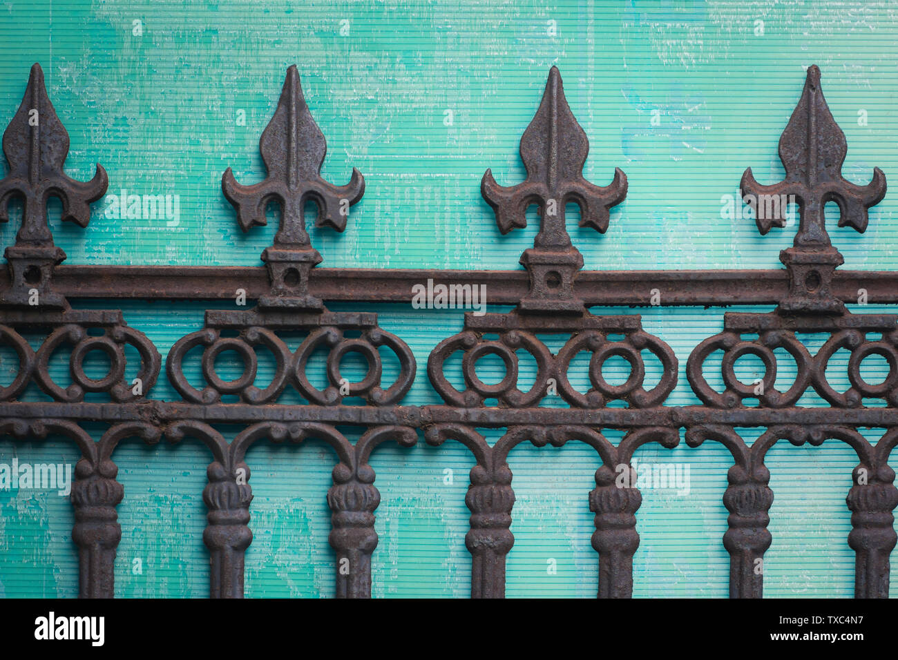 Iron railing and green background Stock Photo - Alamy