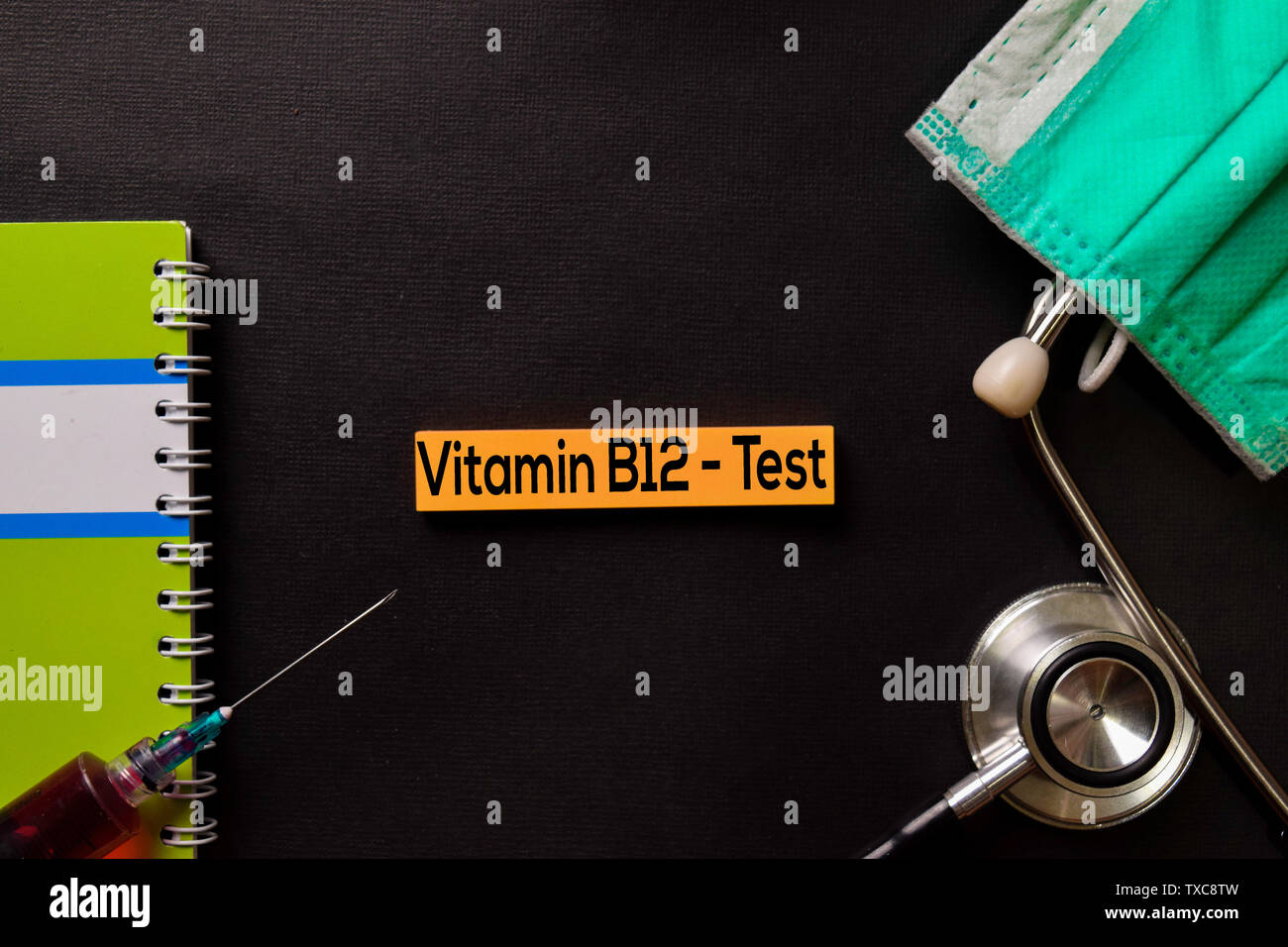 Vitamin B12 Test on top view black table with blood sample and