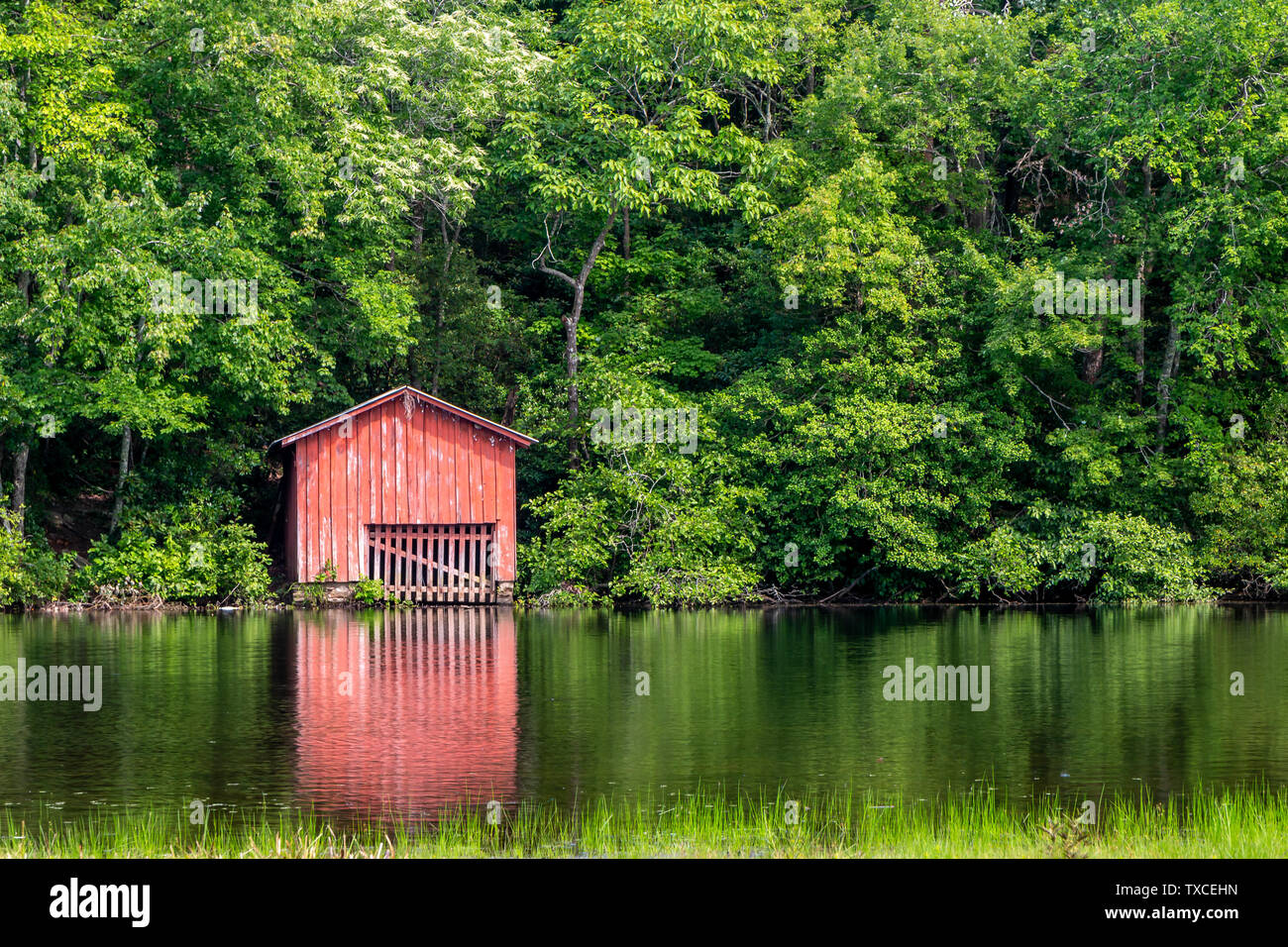 Red boat house on Desoto State Park Lake in the summer. Near Mentone, AL Stock Photo