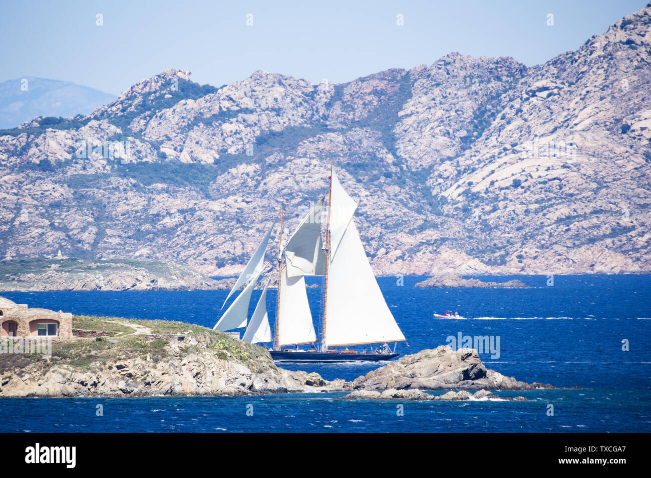 Stunning View Of A Beautiful Sailboat Sailing On The Mediterranean Sea That Bathes The Coasts Of Sardinia Stock Photo Alamy