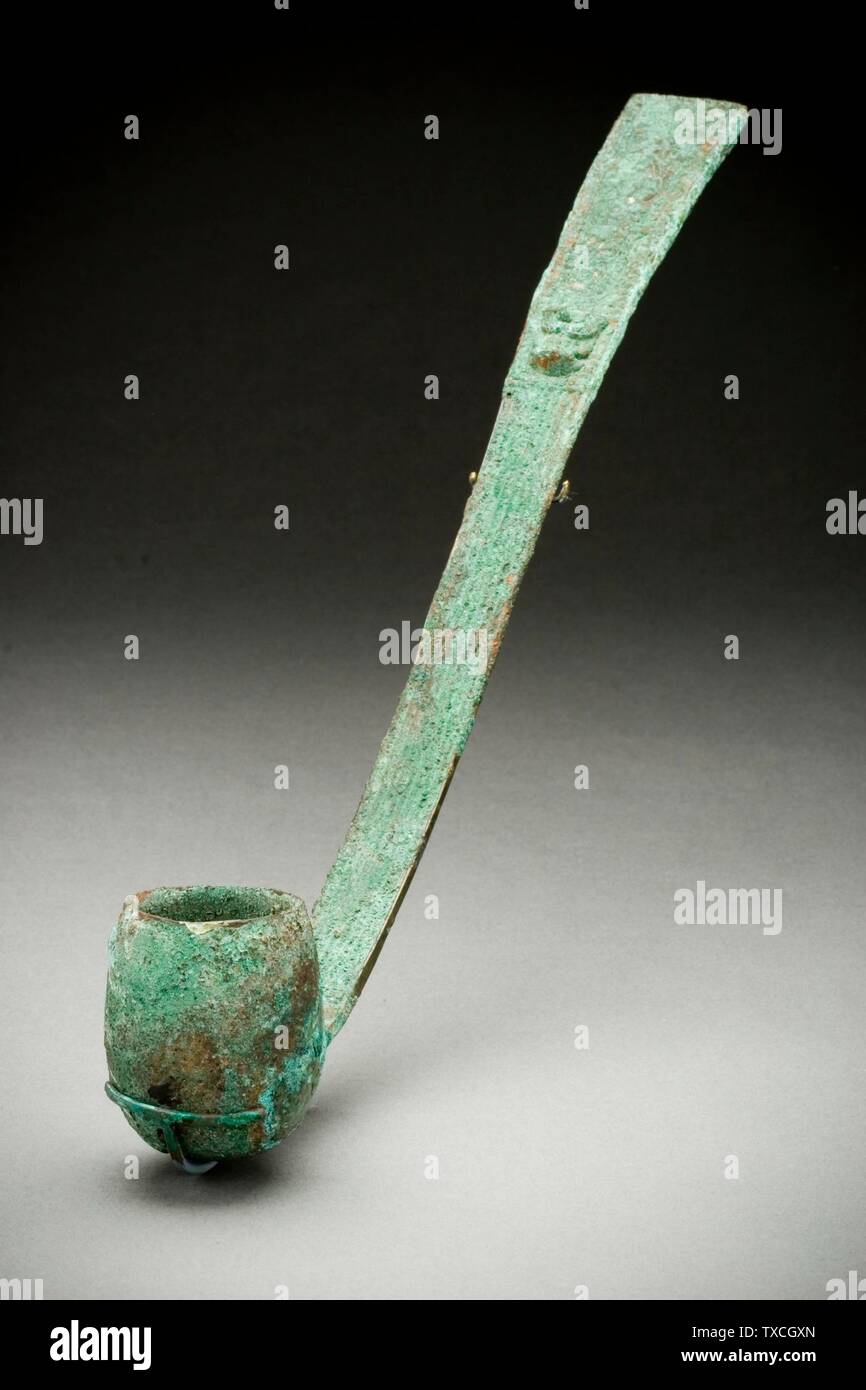 Ritual Ladle (Dou) with Masks; China, probably Henan Province, Late Shang dynasty, Anyang phase, about 1300-1050 B.C. Furnishings; Serviceware Cast bronze Length:  13 1/4 in. (33.66 cm) Purchased with funds provided by Carl Holmes (M.56.3.2) Chinese Art; between circa 1300 and circa 1050 date QS:P571,+1500-00-00T00:00:00Z/6,P1319,+1300-00-00T00:00:00Z/9,P1326,+1050-00-00T00:00:00Z/9,P1480,Q5727902 B.C.; Stock Photo