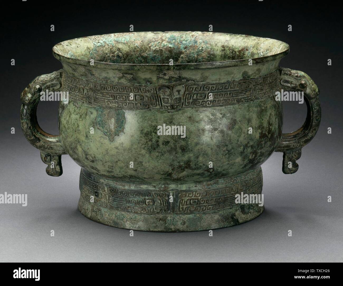 Ritual Grain Server (Gui) with Dragon Handles; China, Late Shang dynasty, late Anyang phase, or early Western Zhou dynasty, about 1100-950 B.C. Furnishings; Serviceware Cast bronze 5 1/4 x 9 5/8 x 7 7/8 in. (13.34 x 24.45 x 20 cm) The Claire Behar Bequest given in honor of George Kuwayama (M.89.136.7) Chinese Art; between circa 1100 and circa 950 B.C.; Stock Photo
