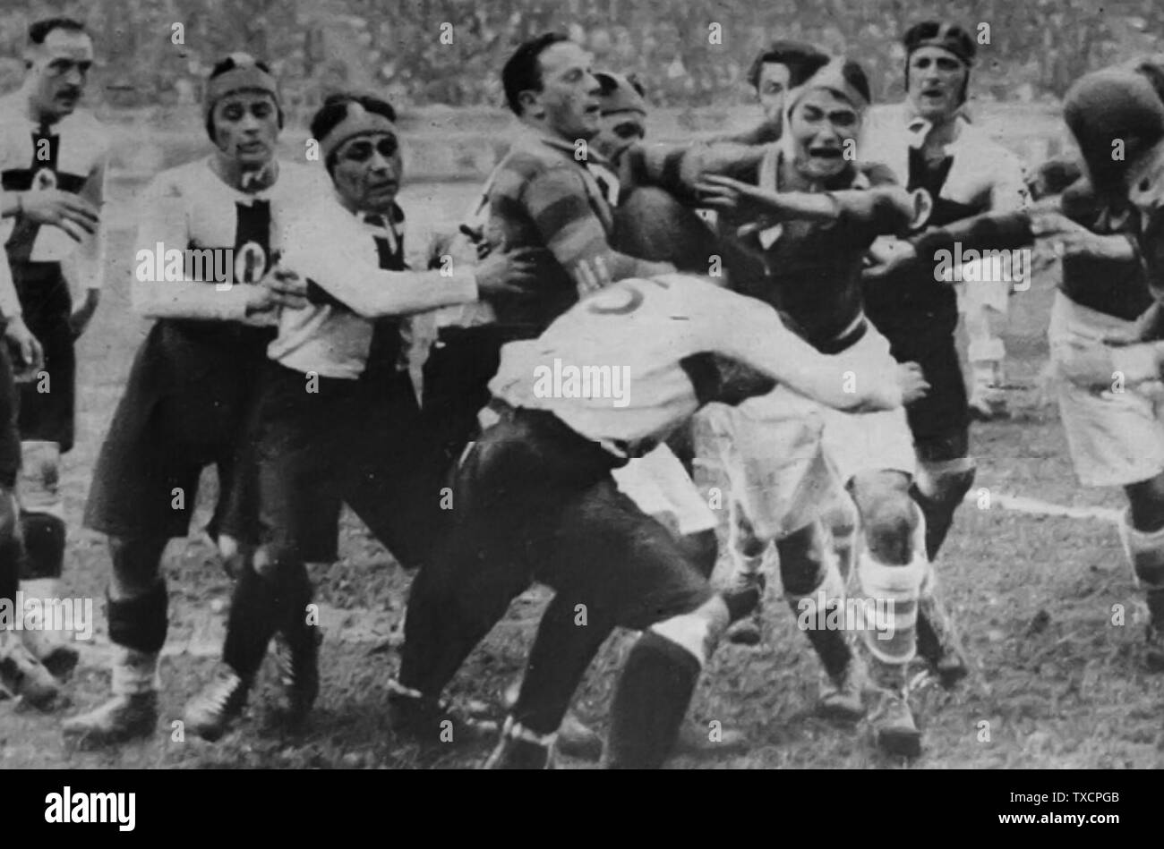 A maul during S.S. Ambrosiana Rugby - Paris UniversitÃ© Club at Arena Civica in Milan. Ambrosiana was then the rugby branch of FC Internazionale Milano and subsequently went on as autonomous club known as Amatori Rugby Milano.; 3 October 1928; Originally published on Tutti gli Sports (Naples), issue 42/1928, 14-21 October 1928; Unknown; Stock Photo