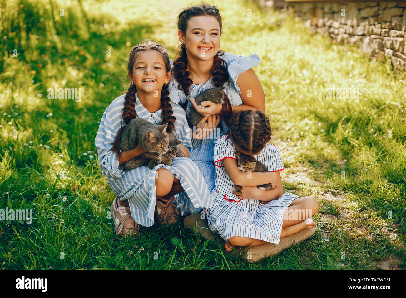 Three Beautiful And Cute Girls In Blue Dresses With Beautiful