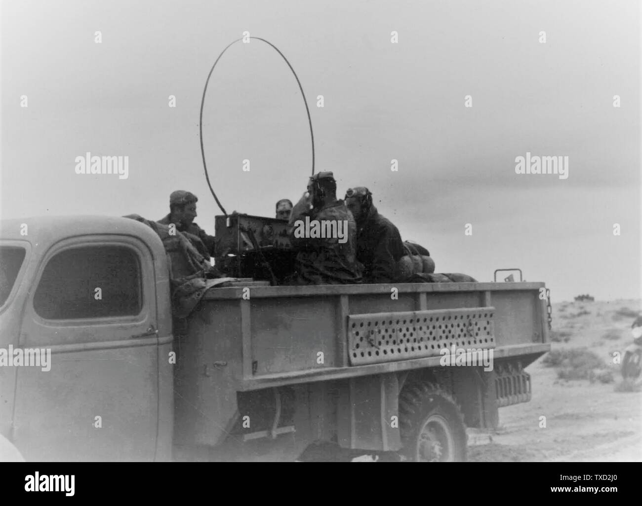 Italian soldiers in a truck with radio in the desert of Bir el Gobu in the  Fall of 1941; 20 November 1941; http://dati.acs.beniculturali.it/SecondaGuerraMondiale/;  Unknown Stock Photo - Alamy