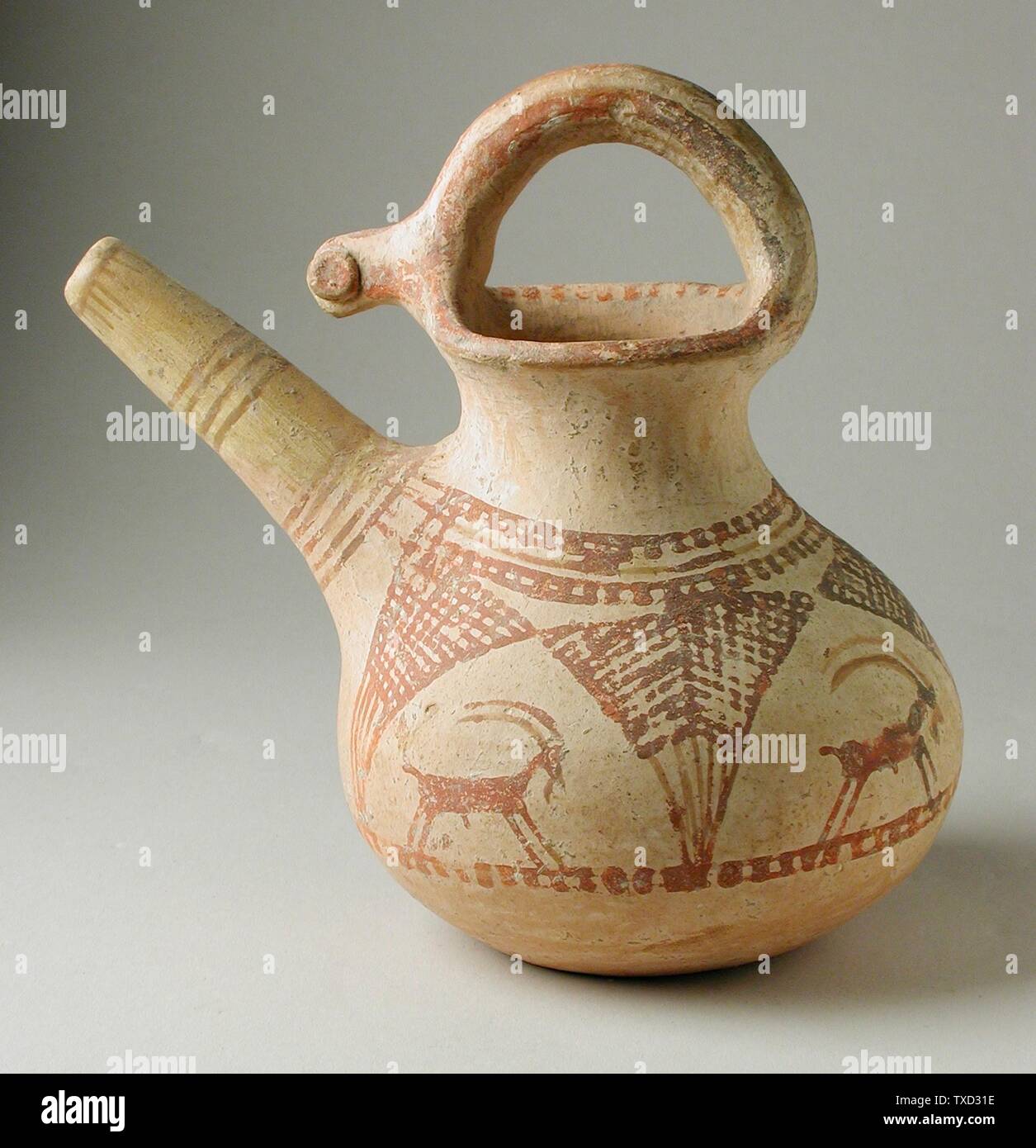 Spouted Jar; Western Iran, circa 1000-650 B.C. Furnishings; Serviceware Buff  ware Height: 4 1/2 in. (11.2 cm); Diameter: 4 1/4 in. (10.7 cm) Gift of  Nasli M. Heeramaneck (M.76.174.188) Art of the