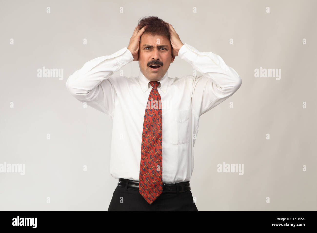 Shocked mature indian man hands hi-res stock photography and images - Alamy