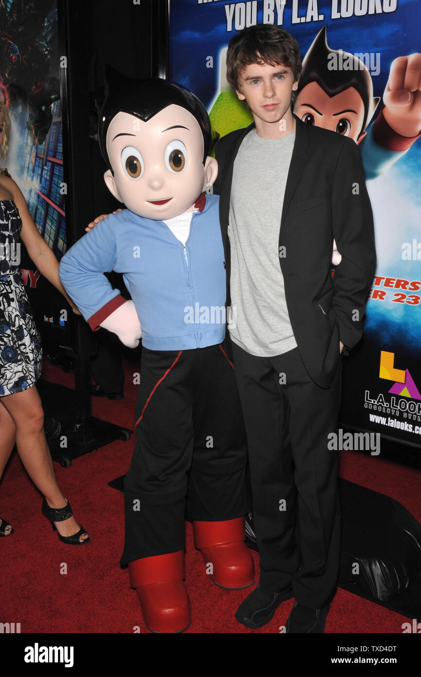 LOS ANGELES, CA. October 19, 2009: Freddie Highmore with Astro Boy  character at the Los Angeles