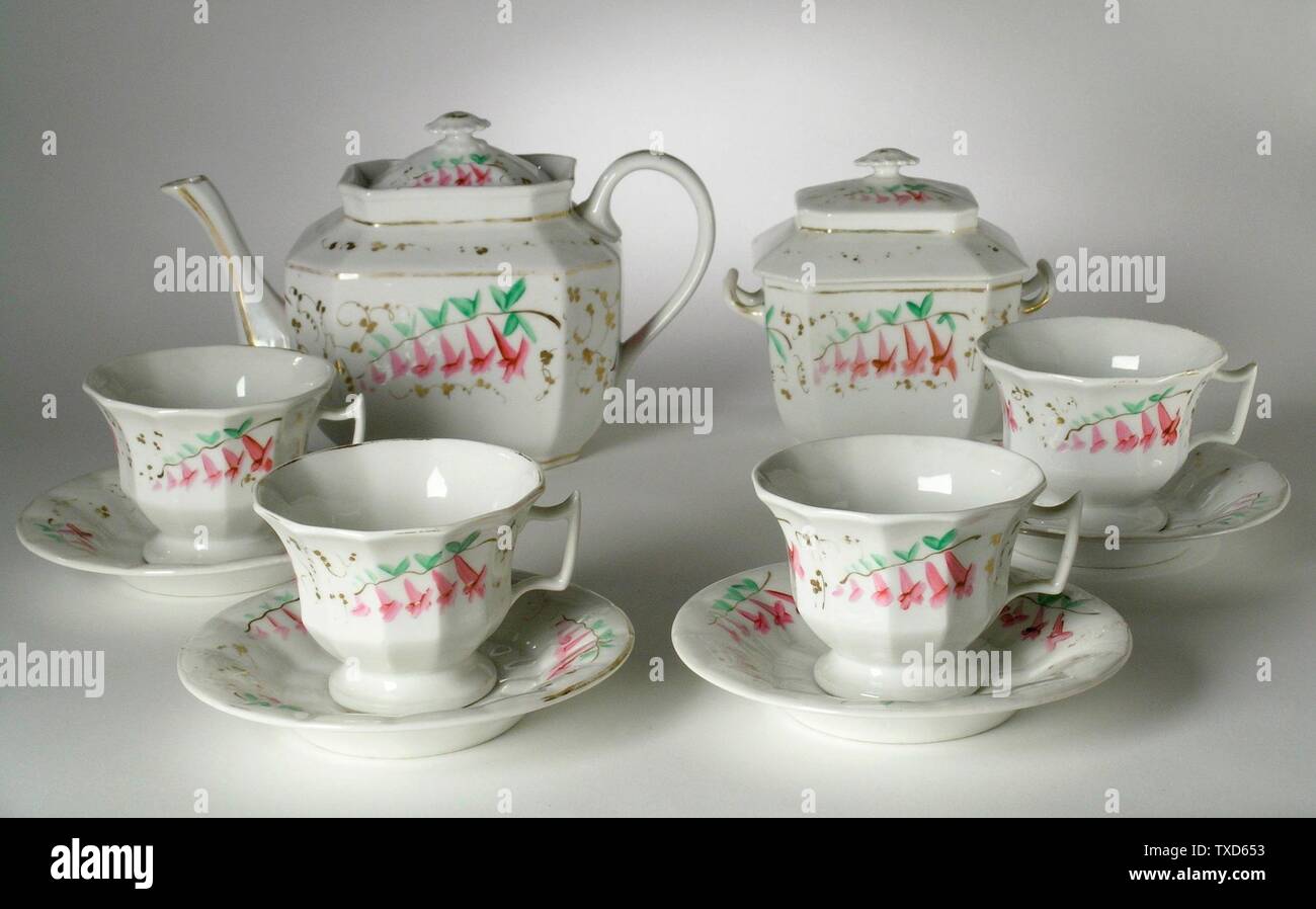 Tea Set; United States, circa 1828-1834 Furnishings; Serviceware Porcelain, painted a-b) Teapot: 6 1/4 x 9 3/4 x 4 3/4 in. (15.88 x 24.77 x 12.07 cm); c-d) Sugarbox: 5 1/2 x 5 3/4 x 3 3/4 in. (13.97 x 14.61 x 9.53 cm); e-l) Cup: 2 7/8 x 4 1/4 x 3 5/8 in. (7.3 x 10.8 x 9.21 cm) each; Saucer height: 5/8 in. (1.59 cm) each; Saucer diameter: 5 3/4 in. (14.61 cm) each Gift of Mr. and Mrs. Robert L. Grim (M.2000.101.1a-l) Decorative Arts and Design; between circa 1828 and circa 1834 date QS:P571,+1850-00-00T00:00:00Z/7,P1319,+1828-00-00T00:00:00Z/9,P1326,+1834-00-00T00:00:00Z/9,P1480,Q5 Stock Photo