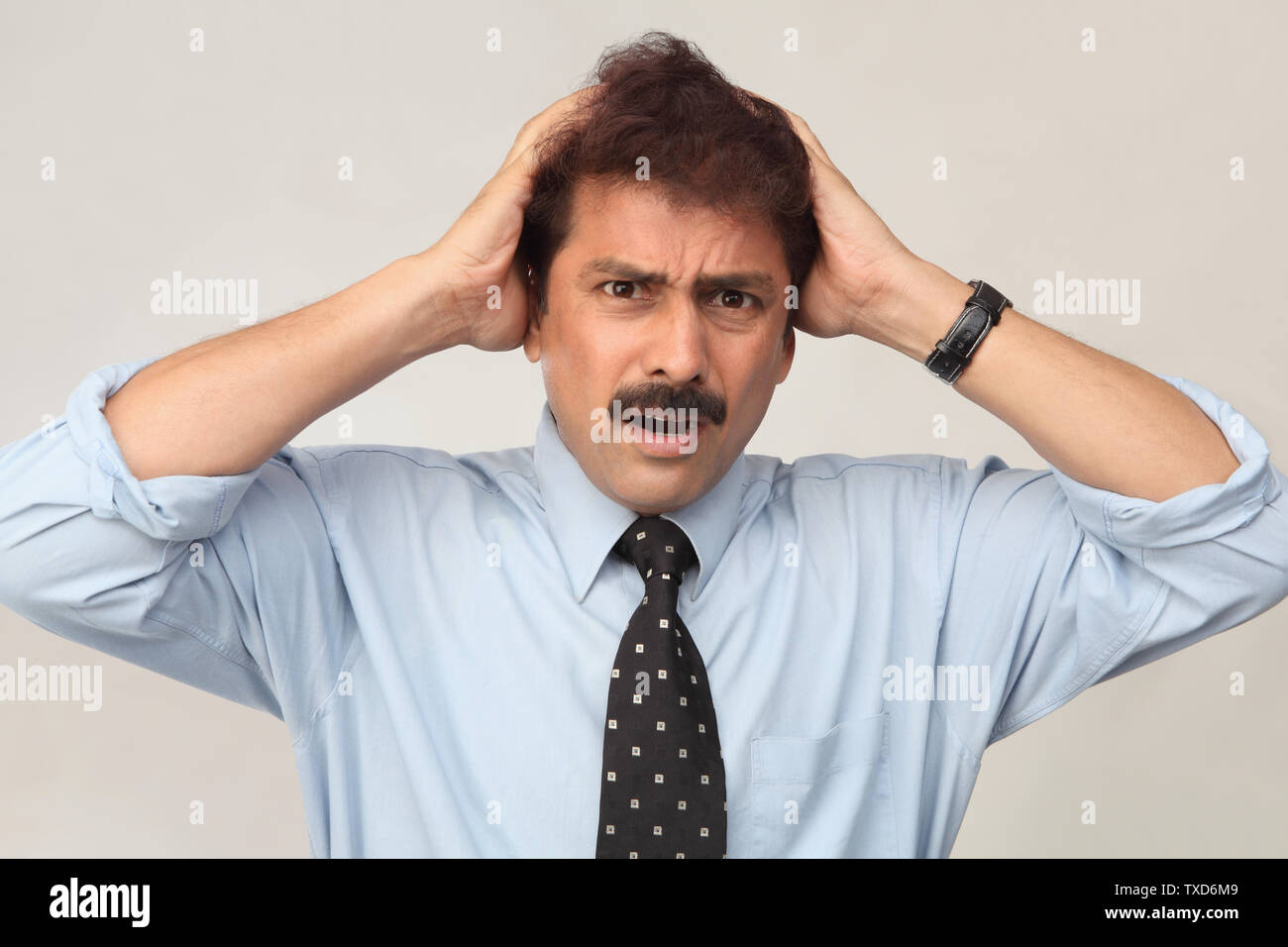 Shocked mature indian man hands hi-res stock photography and images - Alamy