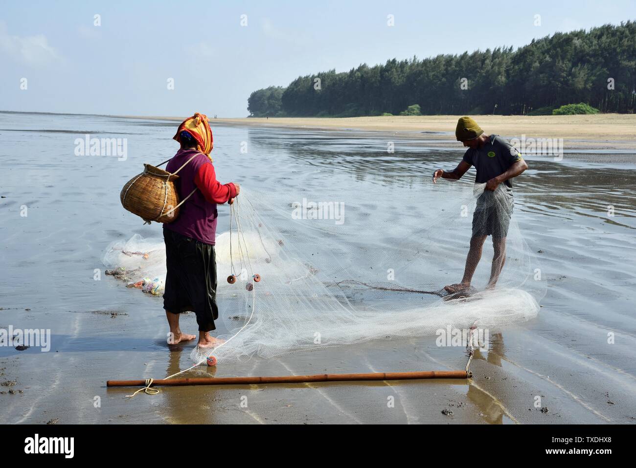 Fisherman couple fishing, Nargol Beach, Valsad, Gujarat, India, Asia ...
