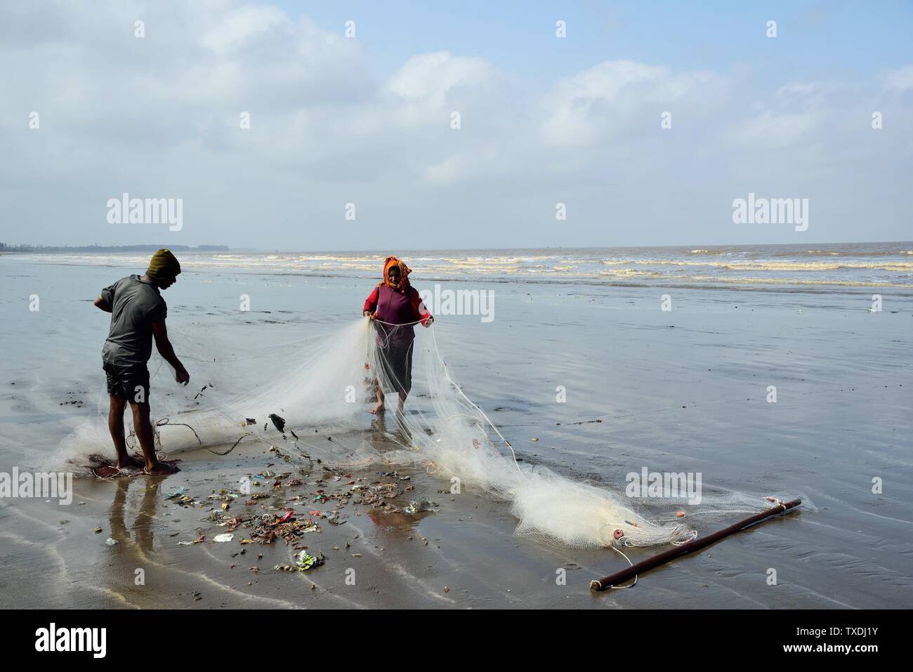 Fisherman couple fishing, Nargol Beach, Valsad, Gujarat, India, Asia ...