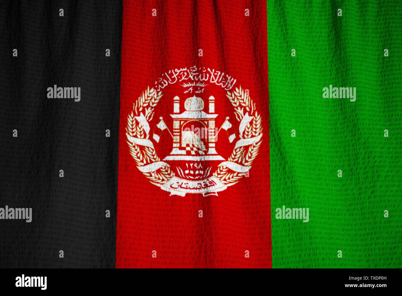 Ruffled Flag of Afghanistan Blowing in Wind Stock Photo