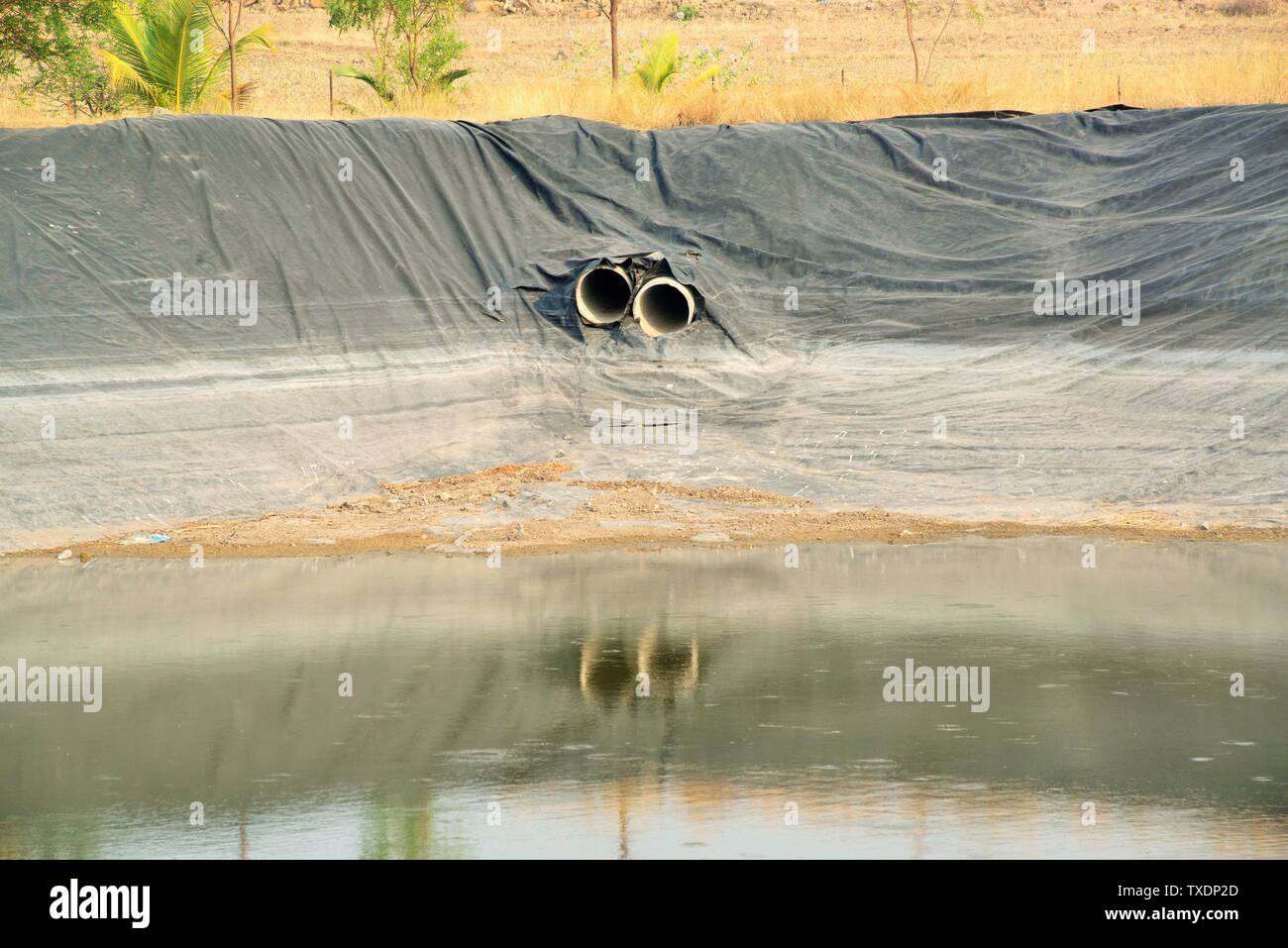 Pond with matting of Plastic sheet, Pune, Maharashtra, India, Asia