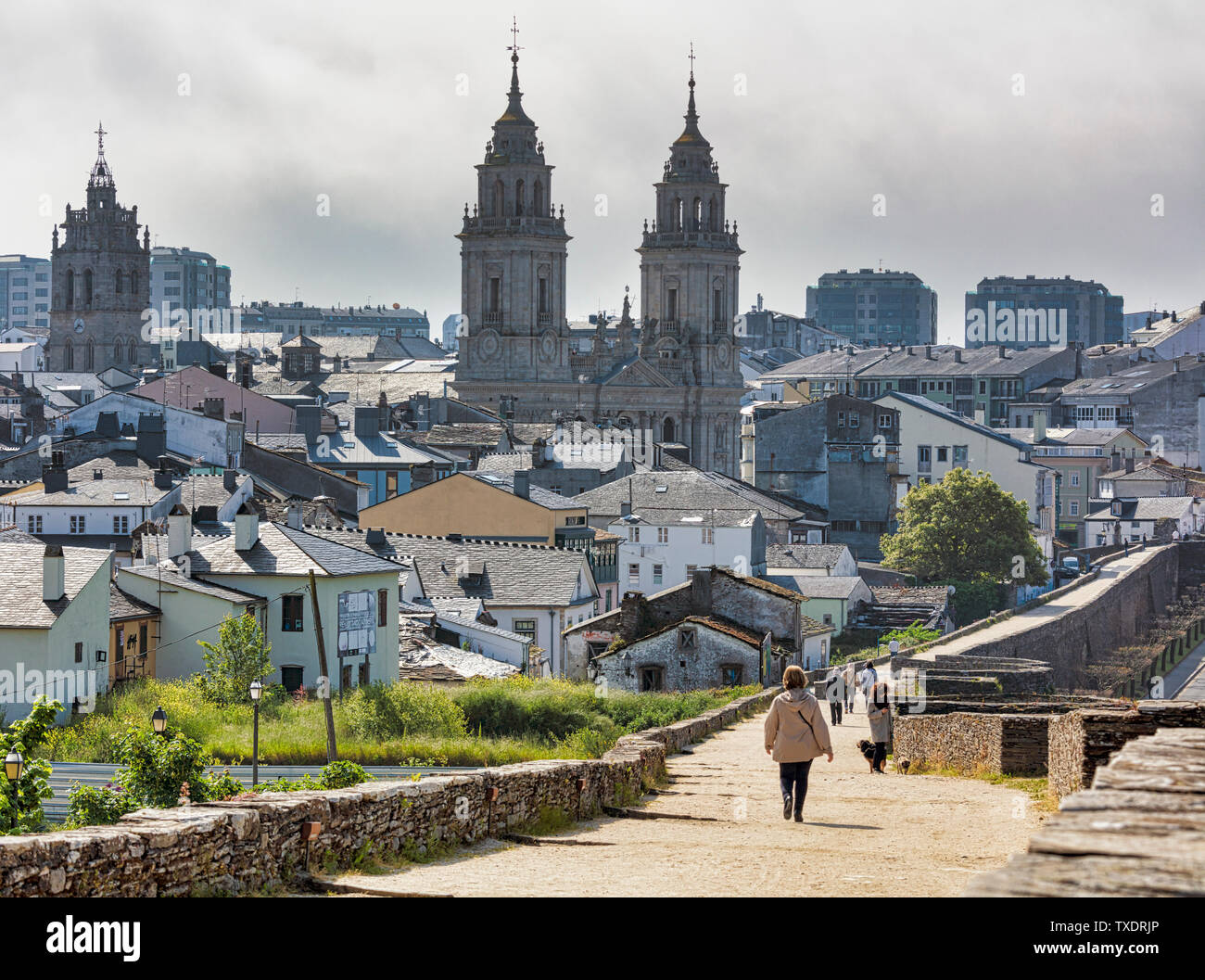 The Roman walls, with the cathedral of Santa Maria in the background, Lugo, Lugo Province, Galicia, Spain.  The Roman walls of Lugo are a UNESCO World Stock Photo