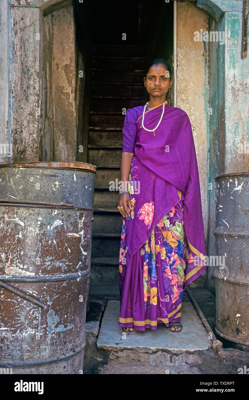 sex worker standing in front of house, Kamathipura, Mumbai, Maharashtra, India, Asia Stock Photo