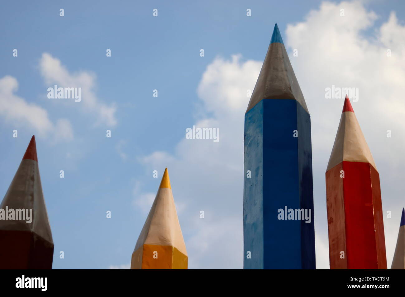 Blue sky pencil crayon building Stock Photo Alamy