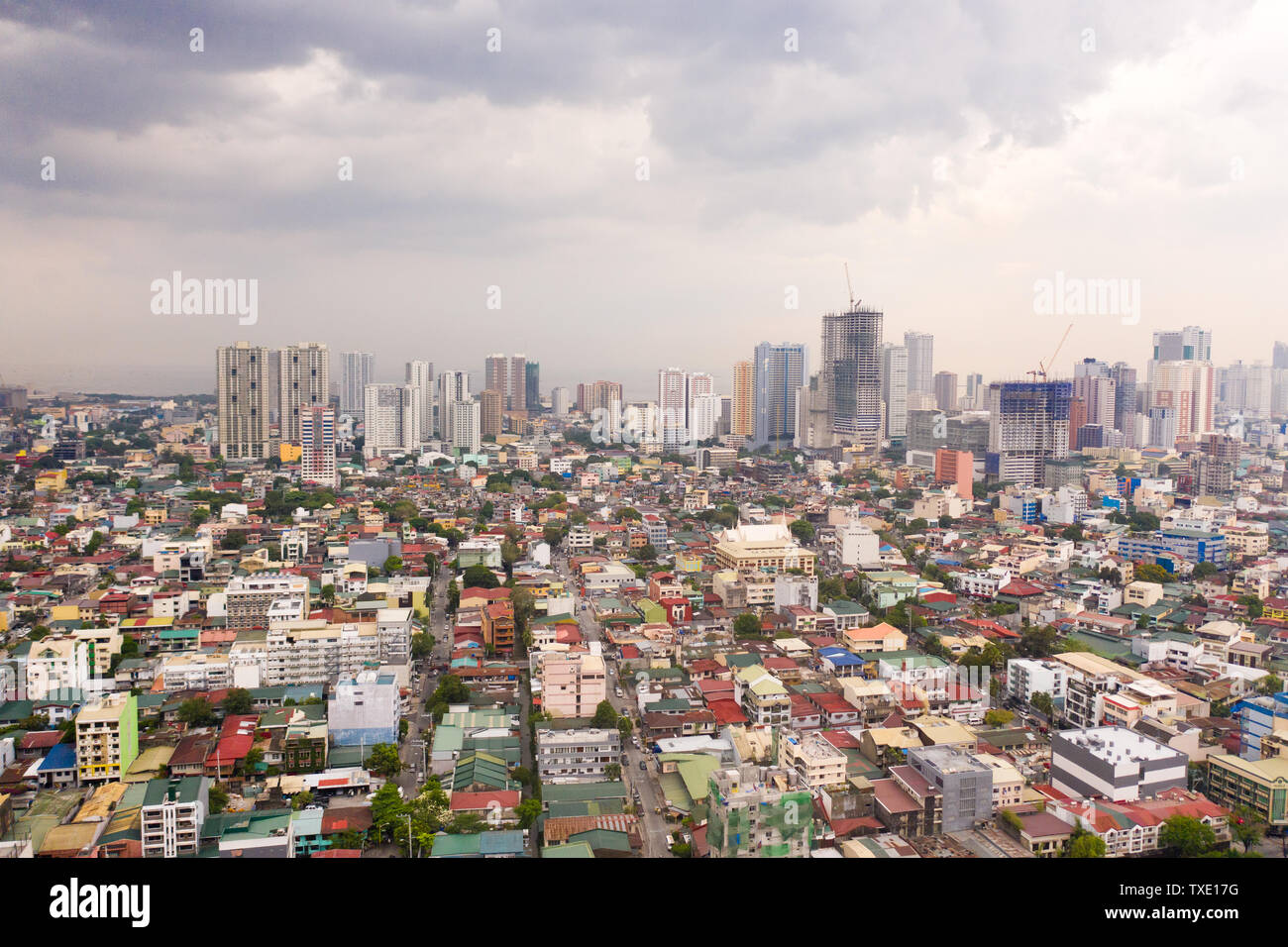 The city of Manila, the capital of the Philippines. Modern metropolis in the morning, top view. New buildings in the city. Panorama of Manila. Skyscrapers and business centers in a big city. Stock Photo