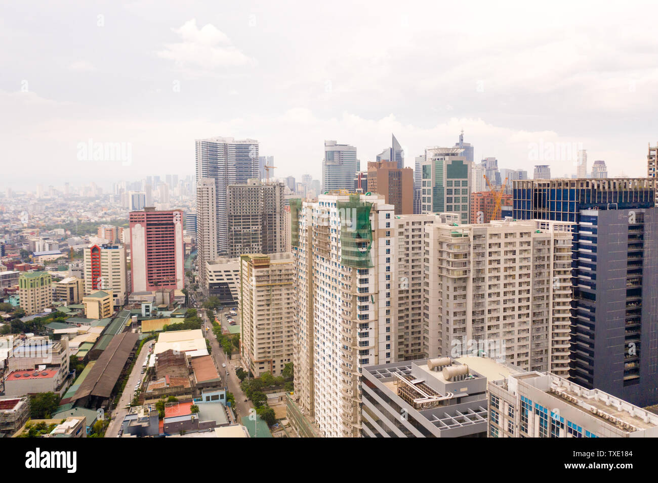 Modern city. The city of Manila, the capital of the Philippines. Modern metropolis in the morning, top view. Modern buildings in the city center. Stock Photo