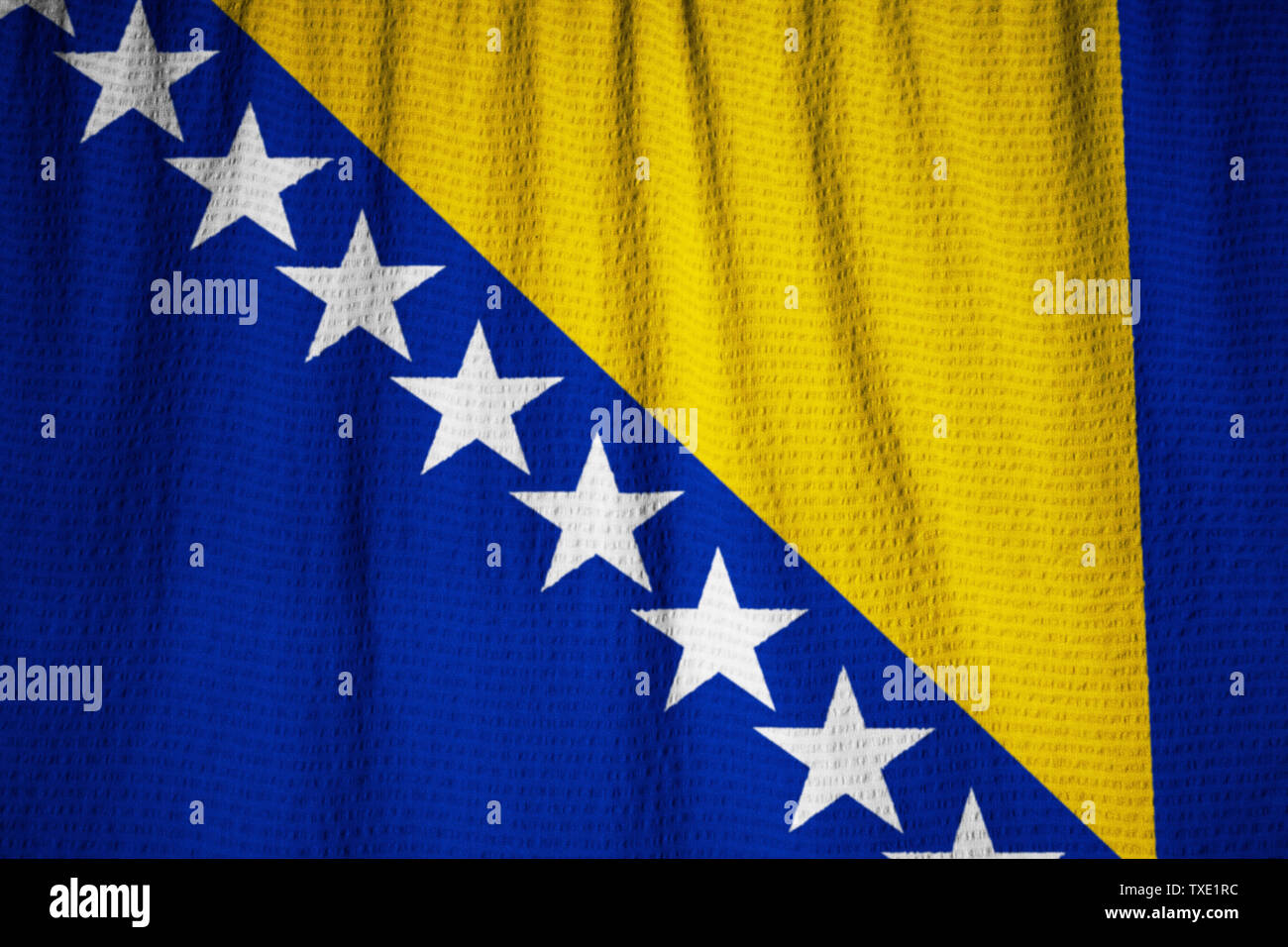 Ruffled Flag of Bosnia and Herzegovina Blowing in Wind Stock Photo