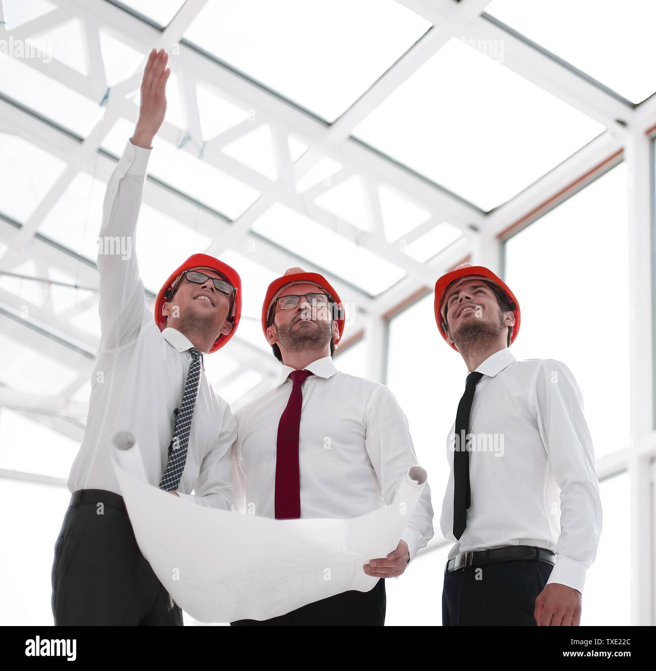 architect shows the customer a new building Stock Photo - Alamy