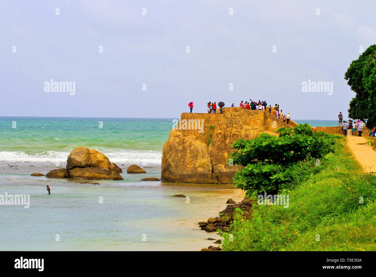 People on promenade inside Dutch fort, Galle, Sri Lanka Stock Photo