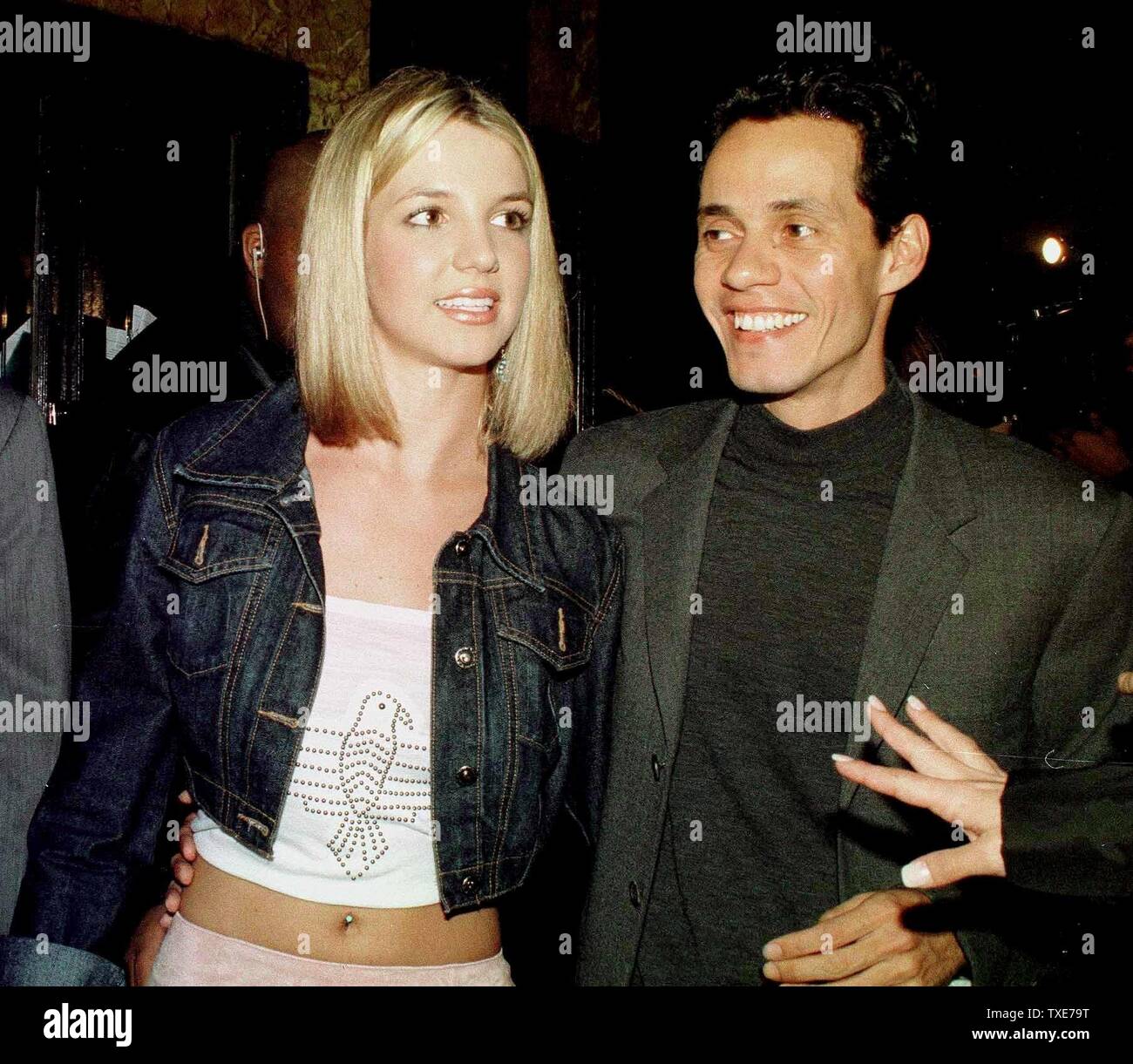 NYP2000010402 - 04 JANUARY 2000 - NEW YORK, NEW YORK, USA: A fan reaches out to Grammy Award nominees Britney Spears and Marc Anthony, January 4 , after the Grammy Awards announcements in New York.   rg/ep/Ezio Petersen  UPI Stock Photo
