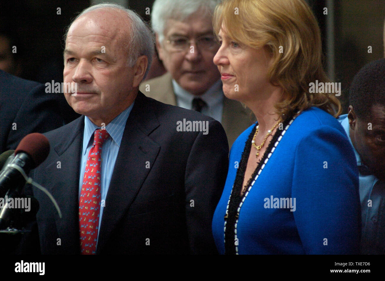 Former Enron CEO Ken Lay addresses the media next to his wife Linda