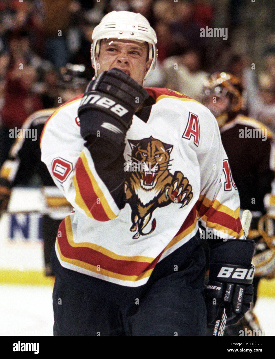 MIA2000011201 - 12 JANUARY 2000 - MIAMI, FLORIDA, USA: Florida Panthers Pavel  Bure scores the game winning goal past New York Islander goalie Kevin Weeks  in second period NHL action. The Panthers