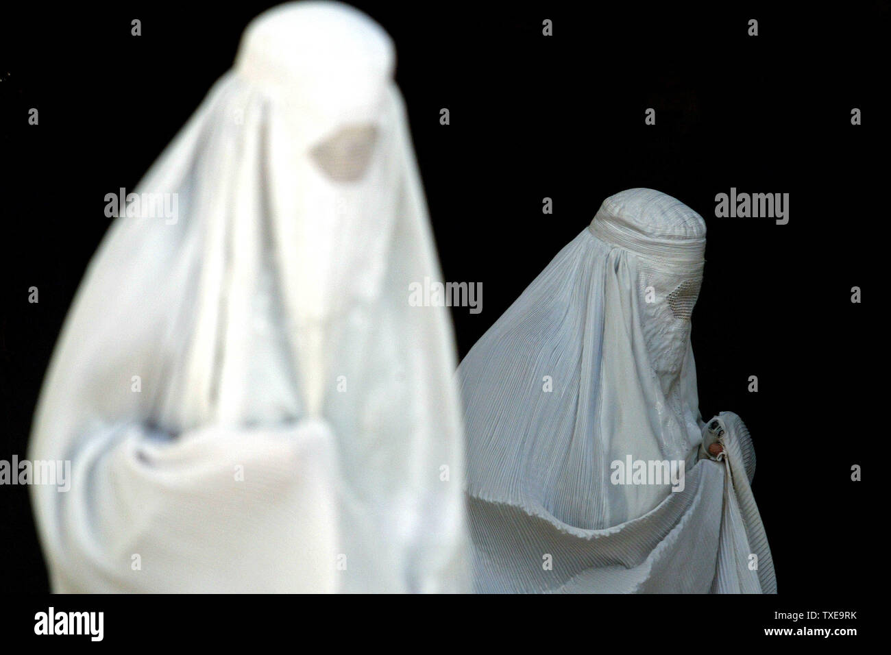White Burqa Clad Women Leave The Blue Mosque After Their Prayers